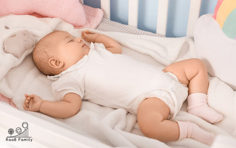 Image of a baby sleeping in the crib 